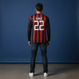 Back view of the Kaká #22 football jersey showing the legendary number 22 printed on a red and black striped full-sleeve shirt.